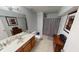Well-lit bathroom with a vanity, toilet, and a shower with a gray curtain at 18247 Kinder Oak Dr, Noblesville, IN 46062