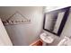 Charming powder room with a pedestal sink and decorative 