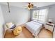 Bright bedroom with a large window, cozy seating, and neutral decor providing a relaxing atmosphere at 18247 Kinder Oak Dr, Noblesville, IN 46062