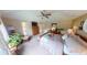 Well-lit bedroom with a ceiling fan, a cozy bed, and neutral decor providing a serene atmosphere at 18247 Kinder Oak Dr, Noblesville, IN 46062