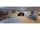 Open-concept basement area with bedroom and desk, illuminated by LED strip lighting at 18247 Kinder Oak Dr, Noblesville, IN 46062