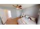 Comfortable bedroom features soft gray walls and a ceiling fan, creating a cozy and inviting space at 18247 Kinder Oak Dr, Noblesville, IN 46062