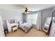 Comfortable bedroom with a ceiling fan, neutral decor, and a vanity area, offering a relaxing space at 18247 Kinder Oak Dr, Noblesville, IN 46062