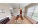 Dining room with a farmhouse table, white chairs, and natural light at 18247 Kinder Oak Dr, Noblesville, IN 46062