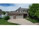 Beautiful two-story home with a brick and vinyl exterior, featuring a well-maintained lawn and mature trees at 18247 Kinder Oak Dr, Noblesville, IN 46062