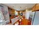 Bright kitchen with wooden cabinets, stainless steel refrigerator, and a spacious center island at 18247 Kinder Oak Dr, Noblesville, IN 46062