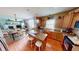 Open kitchen with a center island, oak cabinets, and hardwood floors at 18247 Kinder Oak Dr, Noblesville, IN 46062
