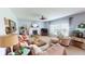 Comfortable living room with a fireplace, ceiling fan, and multiple seating areas for relaxation at 18247 Kinder Oak Dr, Noblesville, IN 46062