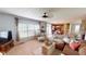 Bright living room with a large window, comfortable seating, and an open layout with a view of the kitchen at 18247 Kinder Oak Dr, Noblesville, IN 46062