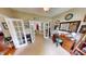 Home office space with french doors, desk, and view of the dining room at 18247 Kinder Oak Dr, Noblesville, IN 46062