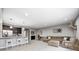 Finished basement featuring a bar area, comfortable seating, and ample space for entertaining and relaxing at 18820 Wychwood Pl, Noblesville, IN 46062