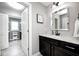 Bathroom featuring a modern vanity with dark wood cabinets and granite countertop at 18820 Wychwood Pl, Noblesville, IN 46062