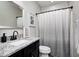 A bathroom featuring a granite vanity and a shower with curtain at 18820 Wychwood Pl, Noblesville, IN 46062