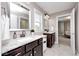 Elegant bathroom with dual vanities, granite countertops, and a view into the bedroom at 18820 Wychwood Pl, Noblesville, IN 46062