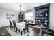 Dining room with blue built-in shelves and a large window at 18820 Wychwood Pl, Noblesville, IN 46062
