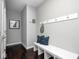 A welcoming foyer features a bench, pillows, and hooks for a tidy and inviting entryway at 18820 Wychwood Pl, Noblesville, IN 46062