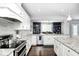Well-equipped kitchen with white cabinets, stainless steel appliances, and granite countertops at 18820 Wychwood Pl, Noblesville, IN 46062