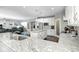 Open kitchen featuring a large island, granite countertops, and modern appliances at 18820 Wychwood Pl, Noblesville, IN 46062