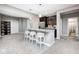 Open-concept kitchen area featuring an island with seating and modern appliances at 18820 Wychwood Pl, Noblesville, IN 46062