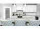 Beautiful kitchen with granite counters, white cabinetry, and modern appliances at 18820 Wychwood Pl, Noblesville, IN 46062