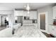Bright, modern kitchen with an island, stainless appliances, and granite countertops at 18820 Wychwood Pl, Noblesville, IN 46062