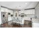 Bright kitchen with white cabinets, granite countertops, and stainless steel appliances at 18820 Wychwood Pl, Noblesville, IN 46062