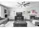 Cozy living room featuring a stone fireplace, TV, and comfortable seating at 18820 Wychwood Pl, Noblesville, IN 46062