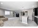 A cozy living room with carpeted floors, a mini bar, and a comfortable couch at 18820 Wychwood Pl, Noblesville, IN 46062