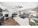 Spacious living room boasts a fireplace, ceiling fan, and access to the kitchen at 18820 Wychwood Pl, Noblesville, IN 46062