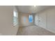 Bright bedroom featuring neutral walls, plush carpeting, two bright windows, and closet space for a serene and inviting feel at 1918 Cornell Ave, Indianapolis, IN 46202