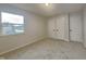 Bright bedroom features neutral walls, carpet floors, natural light, and closet space creating a cozy and inviting atmosphere at 1918 Cornell Ave, Indianapolis, IN 46202