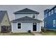 Charming two-story home with blue siding, dark roof, and inviting front entrance at 1918 Cornell Ave, Indianapolis, IN 46202