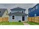 Charming two-story home with a black door and a well-maintained front yard and a nice walkway at 1918 Cornell Ave, Indianapolis, IN 46202