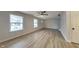 Bright living room with new flooring, two windows, and a ceiling fan providing comfort and style at 1918 Cornell Ave, Indianapolis, IN 46202