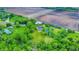 Aerial view of country home with pond and barn, offering a peaceful retreat surrounded by nature at 1933 S 825 E, Zionsville, IN 46077