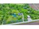 Picturesque aerial view of a secluded home with a pond, large outbuilding and mature trees at 1933 S 825 E, Zionsville, IN 46077