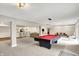 Spacious finished basement featuring a pool table, bar, and a cozy seating area for entertaining at 1933 S 825 E, Zionsville, IN 46077