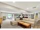 Basement area with light colored carpet, neutral walls, a large sectional, and several seating areas at 1933 S 825 E, Zionsville, IN 46077