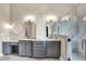 Updated bathroom with dual sinks, vanity, marble counters and frameless glass shower at 1933 S 825 E, Zionsville, IN 46077