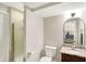 Bathroom featuring tiled shower with glass door, toilet, vanity with sink and granite counter at 1933 S 825 E, Zionsville, IN 46077