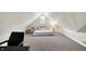 Spacious bedroom features a sloped ceiling, accent windows, and cozy carpeting at 1933 S 825 E, Zionsville, IN 46077