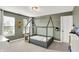 Playful bedroom featuring a gray modern frame bed, traffic light decor and bright natural lighting at 1933 S 825 E, Zionsville, IN 46077