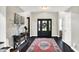 Elegant entryway featuring a dark wood floor, stylish rug, and a modern console table at 1933 S 825 E, Zionsville, IN 46077