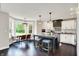 Eat-in kitchen featuring stainless appliances, a center island, and a breakfast nook with bay windows at 1933 S 825 E, Zionsville, IN 46077