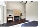 Light filled main bedroom with vaulted ceilings, fireplace, and a sitting area at 1933 S 825 E, Zionsville, IN 46077