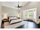 Main bedroom features a vaulted ceiling, dark hardwood floors, and a bay window seating area at 1933 S 825 E, Zionsville, IN 46077