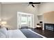 Bright main bedroom with vaulted ceilings, fireplace, bay window and dark hardwood floors at 1933 S 825 E, Zionsville, IN 46077