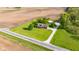 Picturesque property with a lovely home, lush lawn, and outbuilding, surrounded by serene agricultural fields at 2221 W County Road 500 N, Danville, IN 46122