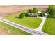 Sprawling property featuring a charming home, large lawn, and outbuilding nestled amidst picturesque farmland at 2221 W County Road 500 N, Danville, IN 46122