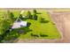 Expansive property with a large metal outbuilding and surrounding fields creates a private rural retreat at 2221 W County Road 500 N, Danville, IN 46122